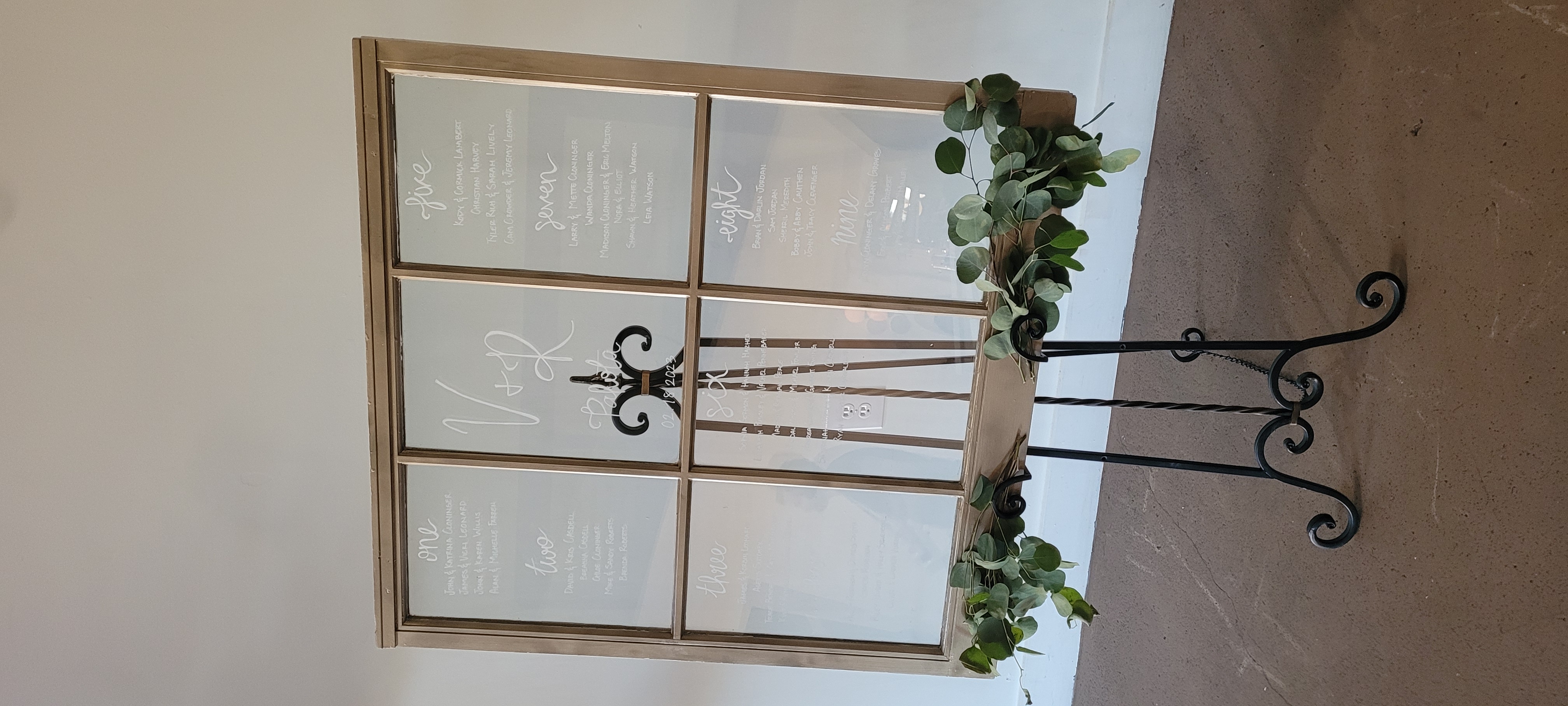 wedding guest seating chart on antique window