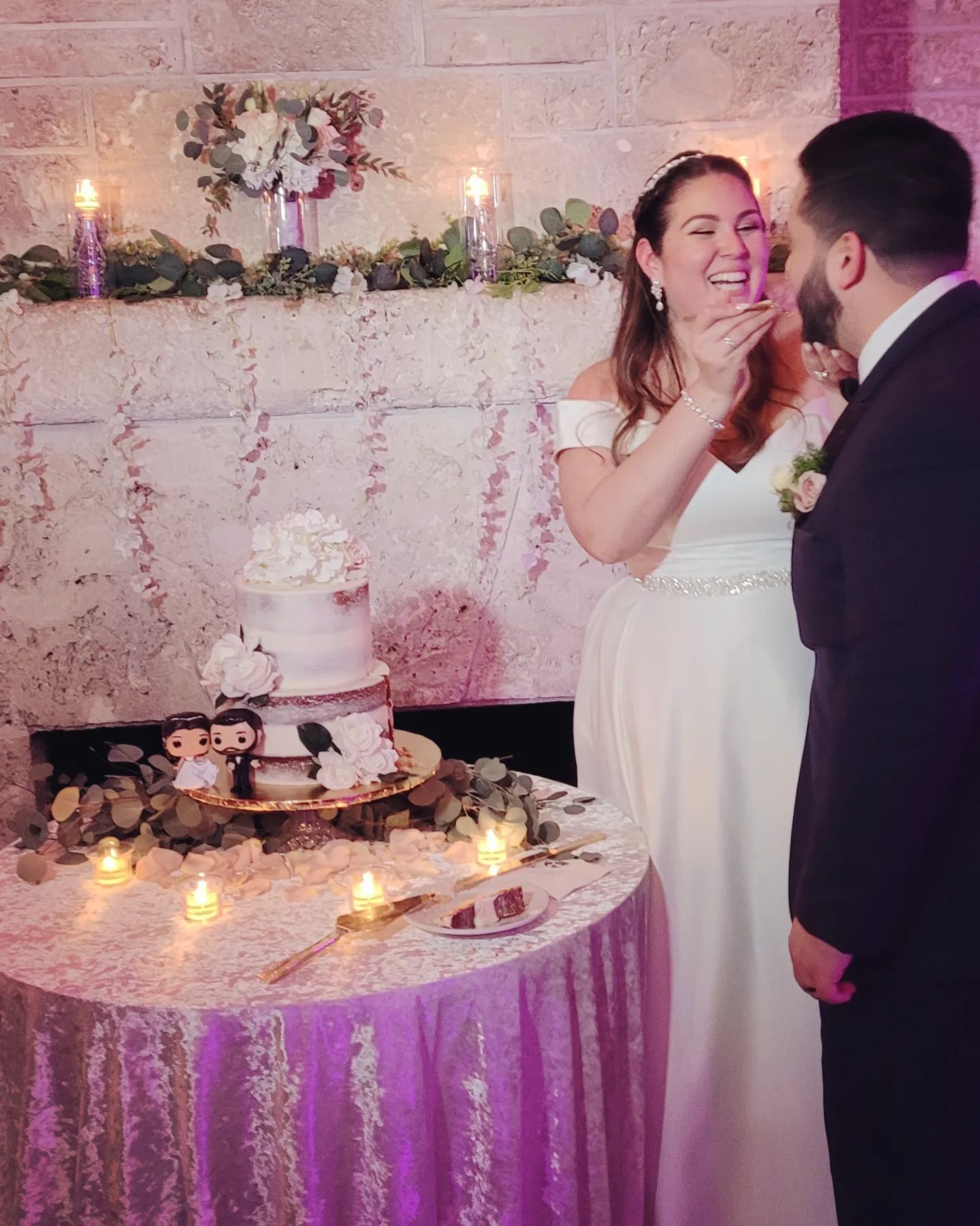 bride feeding groom cake