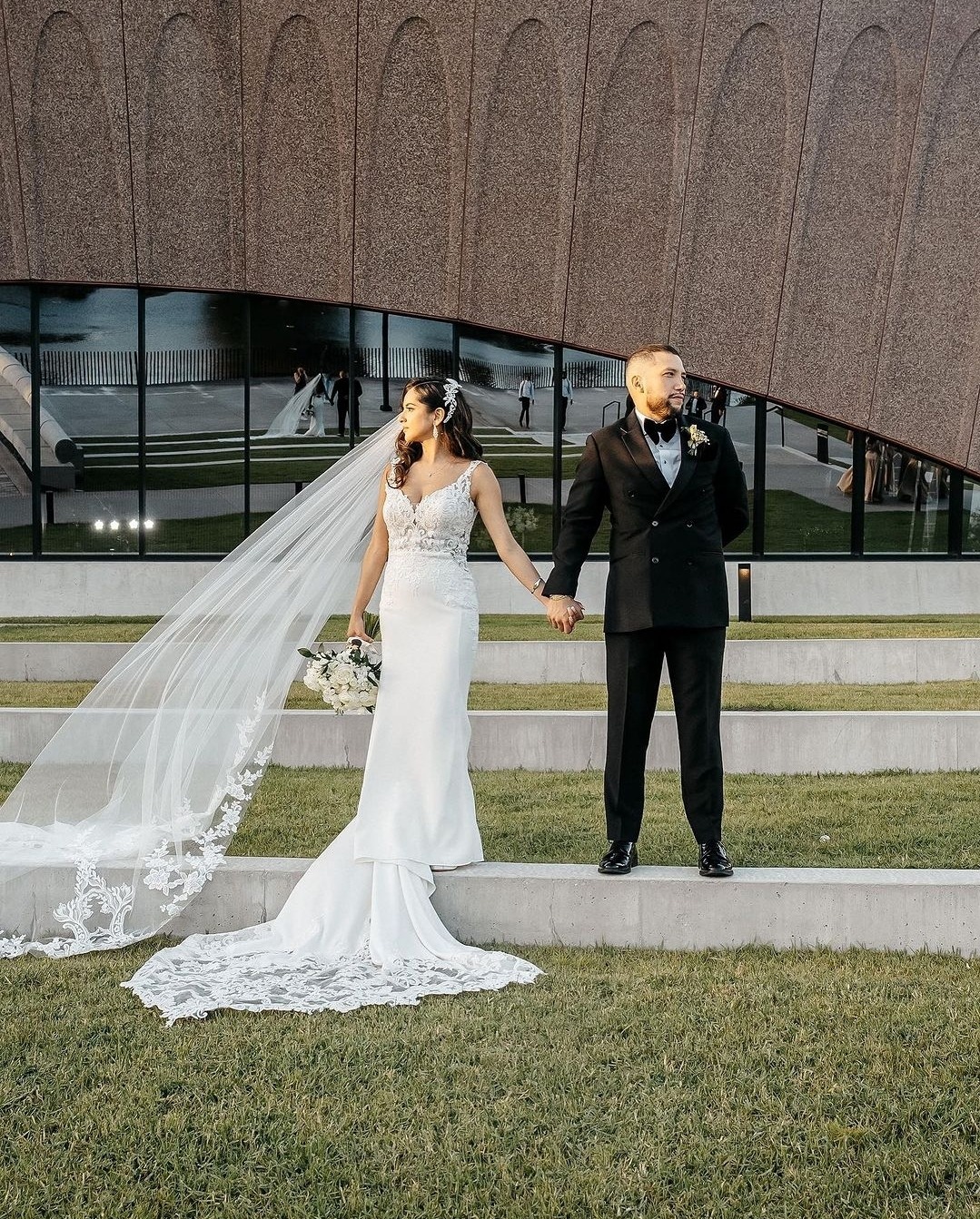 bride and groom holding hands
