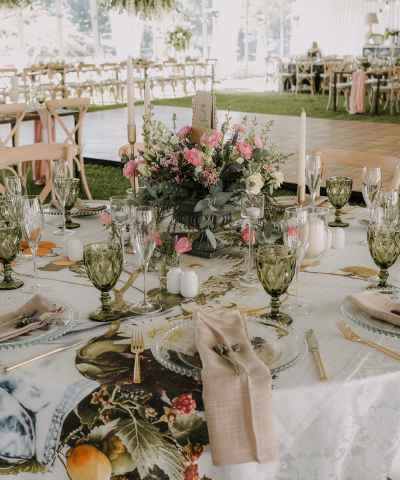 outdoor wedding reception table with pink and green detailing