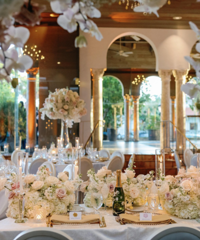 lavish white floral arrangements at wedding reception