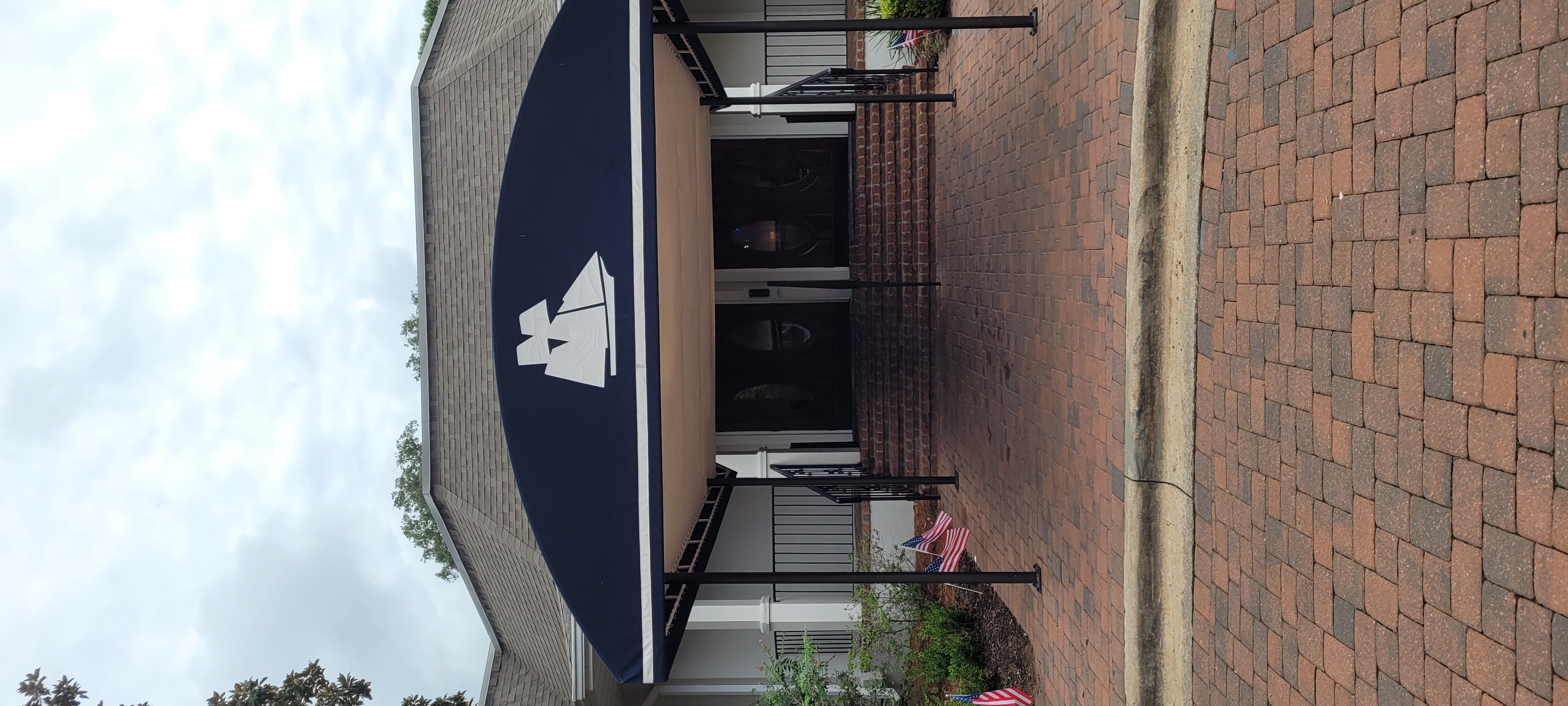 entrance canopy with a sailboat printed on it