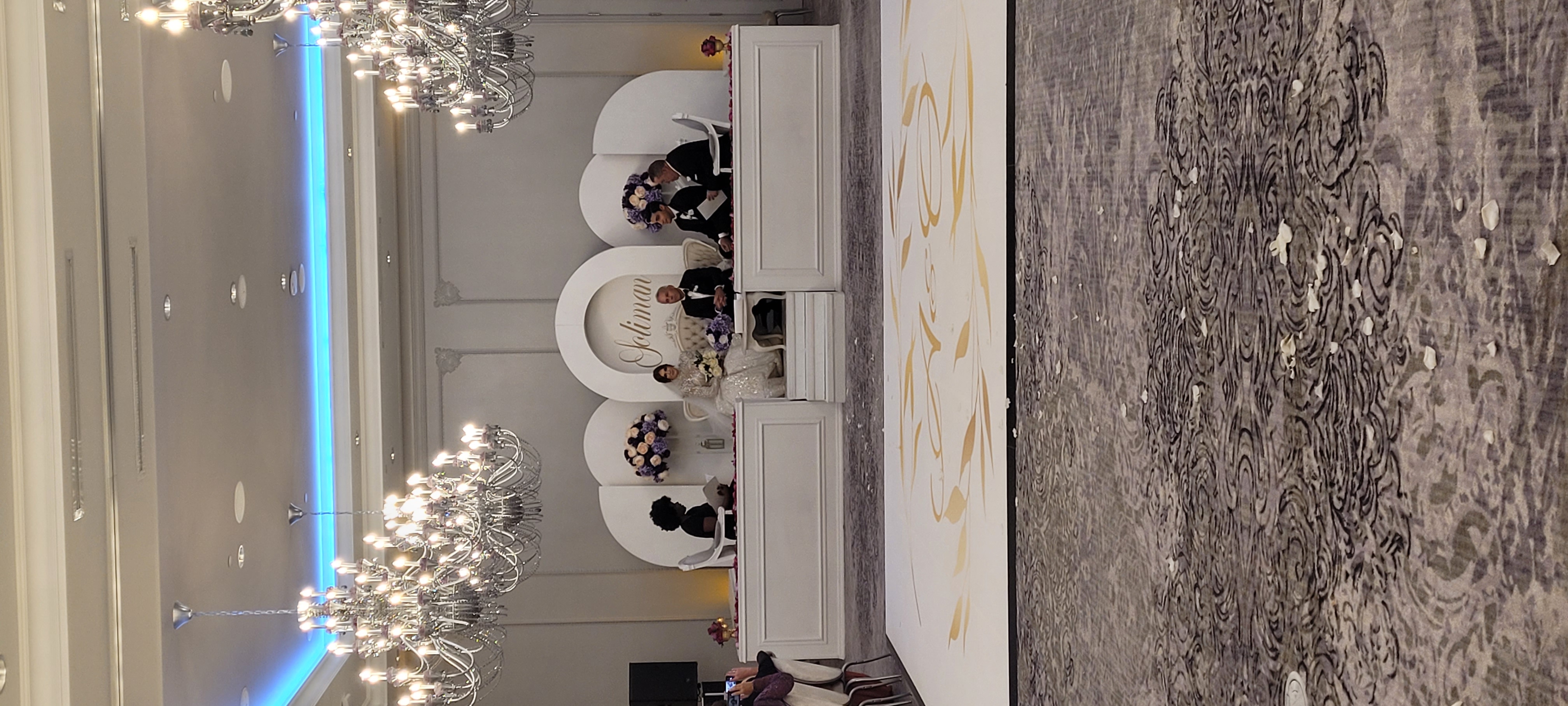 bride and groom sitting on a stage