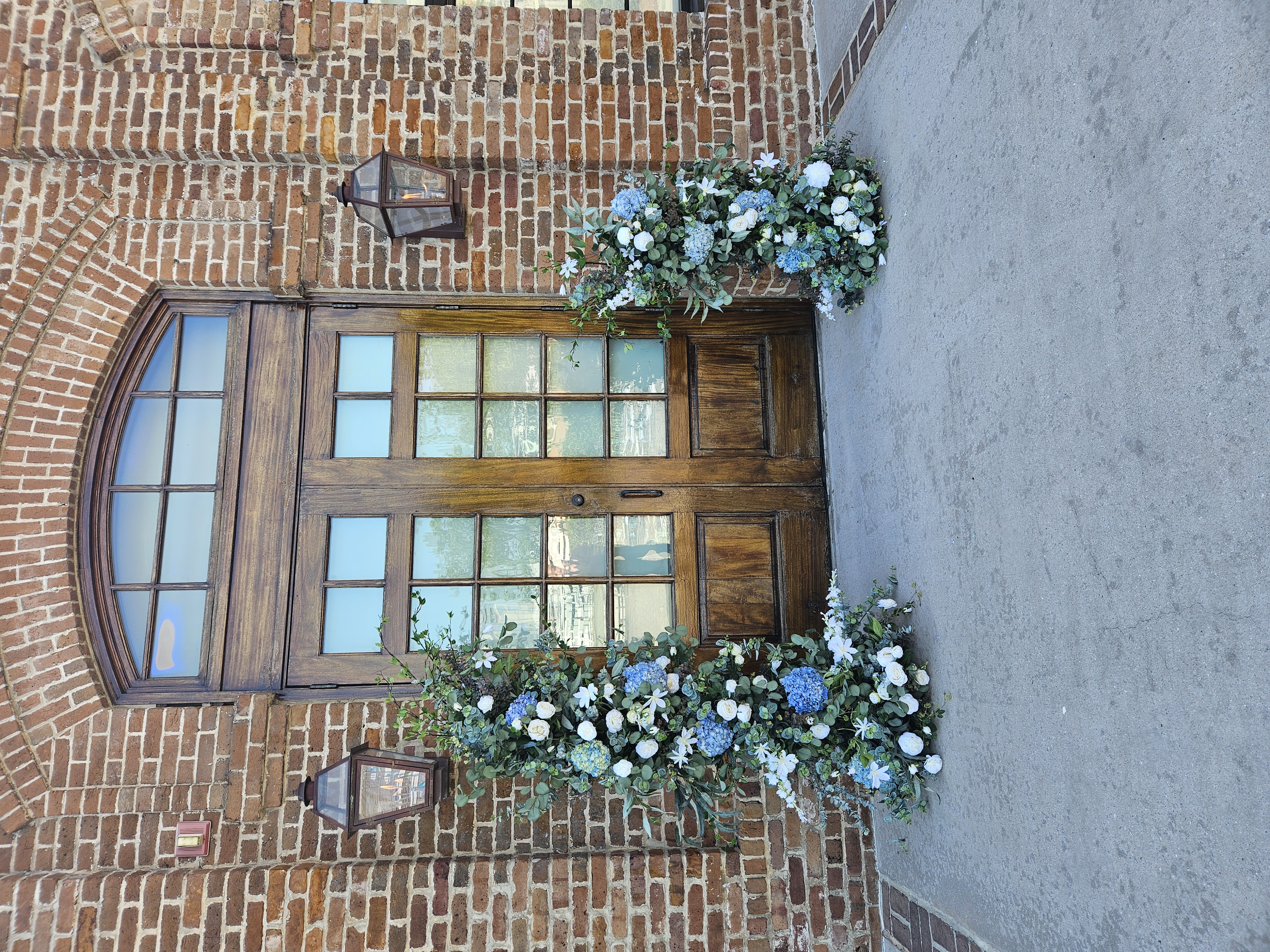 large flower arrangements outside venue door