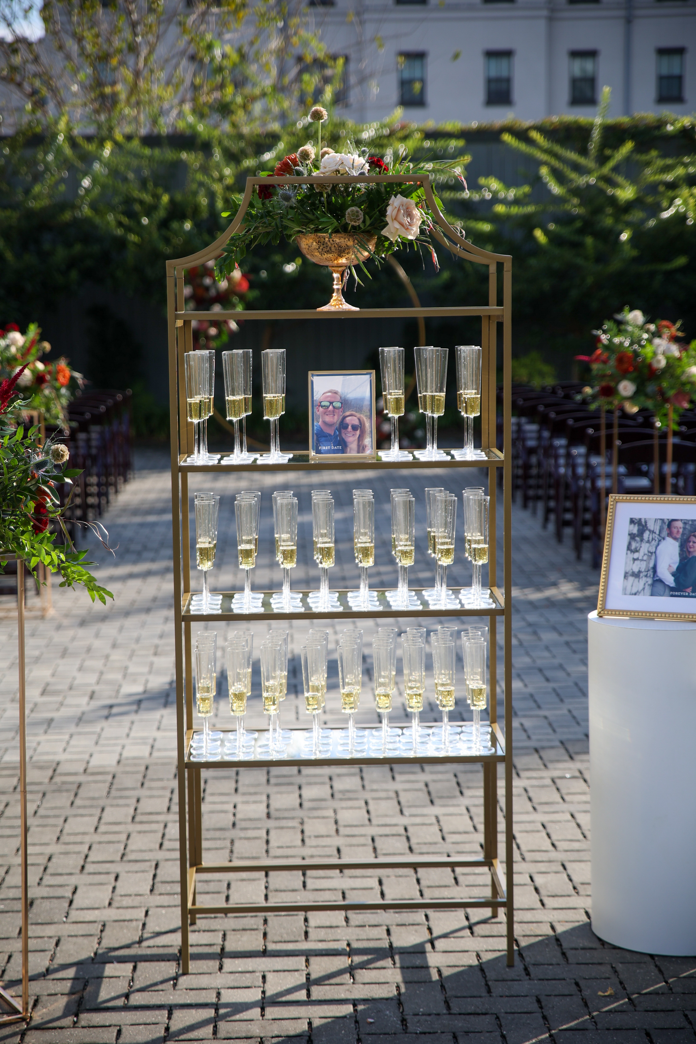 gold shelf with champagne for wedding guests