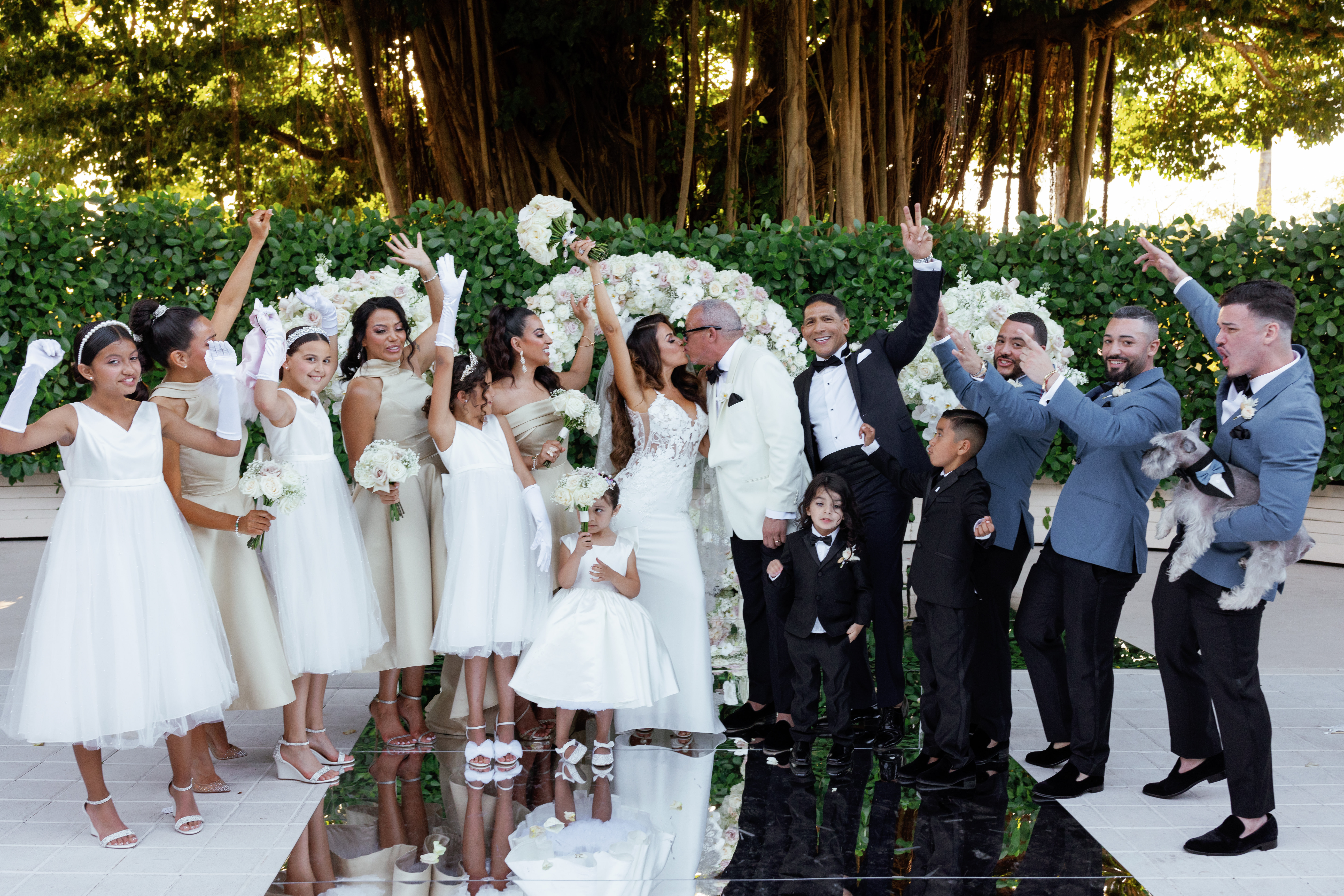 bride and groom with wedding party celebrating